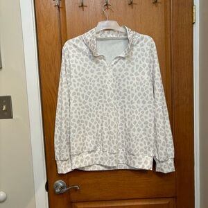 Pull over with zip up neckline.